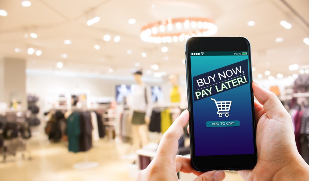 Bnpl,buy,now,pay,later,online,shopping,concept.hands,holding,mobile